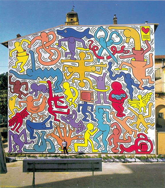 Keith Haring, Tuttomondo, 1989, acrilico su intonaco, 1000×1800 cm. Pisa, facciata laterale della Chiesa di Sant’Antonio abate