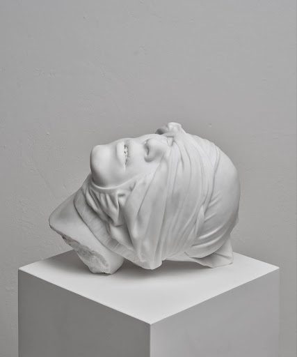 Reza Aramesh, “Action 241: Study of the Head as Cultural Artefacts” 2023. Hand carved and polished Bianco Michelangelo marble, 32 x 40.8 x 31.2 cm. Edition 1 of 3 + AP. Photograph by Laura Veschi. Courtesy of Reza Aramesh Studio.