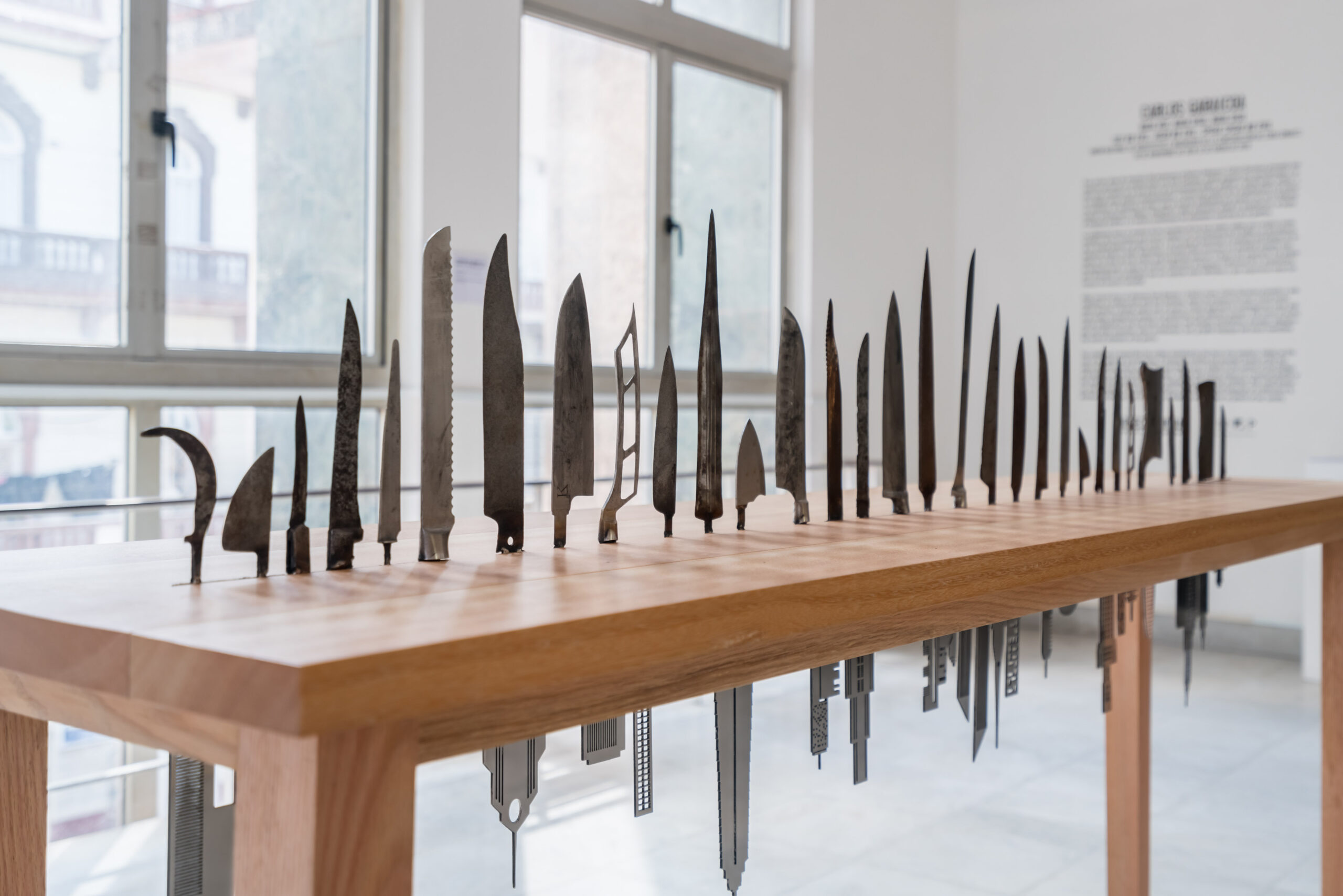 Carlos GaraicoaLas Raíces del Mundo, 2018 inox steel buildings, knives Courtesy Galleria Continua